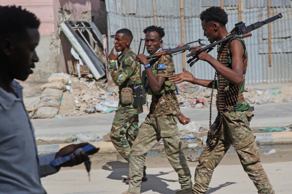 Somali soldiers patrol a street after supporters of opposition political figures and state security forces clashed in Mogadishu, Somalia, Thursday, June 4, 2026. (AP Photo/Farah Abdi Warsameh)