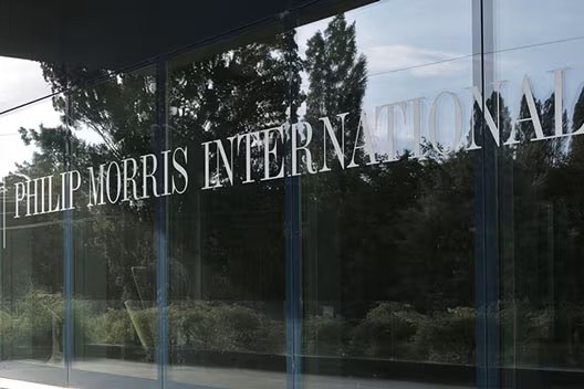 Philip Morris International printed on a glass window