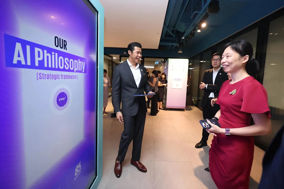 Minister of State for Digital Development and Information Jasmin Lau viewing an interactive board at the launch of the KPMG Trusted AI Centre of Excellence on May 25.
