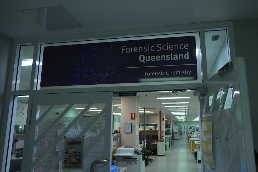 A sign reads "Forensic Science Queensland".