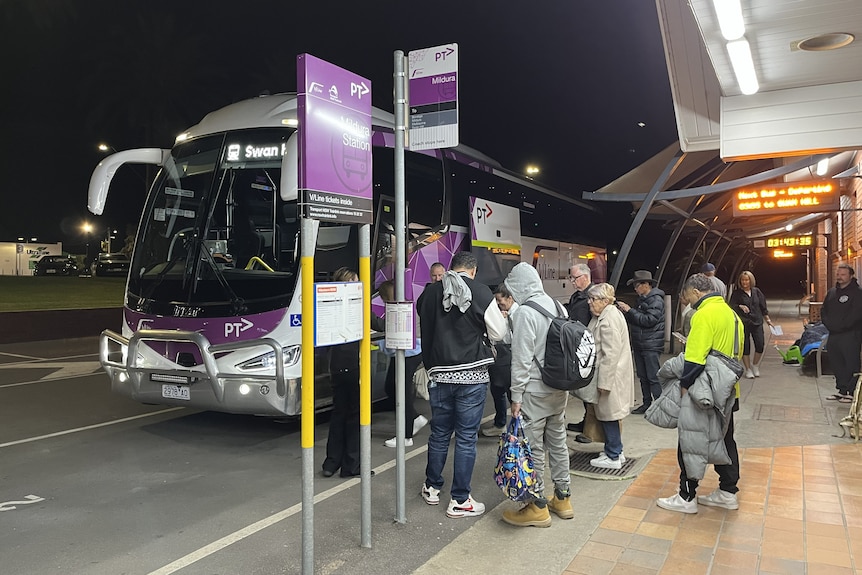 commuters wait at the Mildura bus station in the early hours of the morning hoping to take a 'ghost booking'