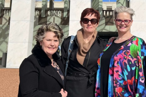 Angela, Gail and Roxanne wear warm clothes and hug each other.