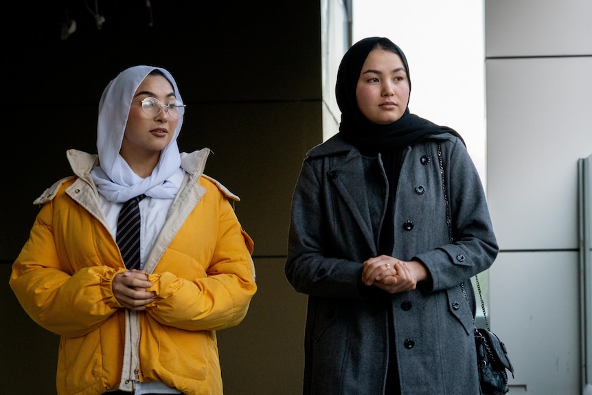 Arya and Adiba stand together, pondering towards the sky