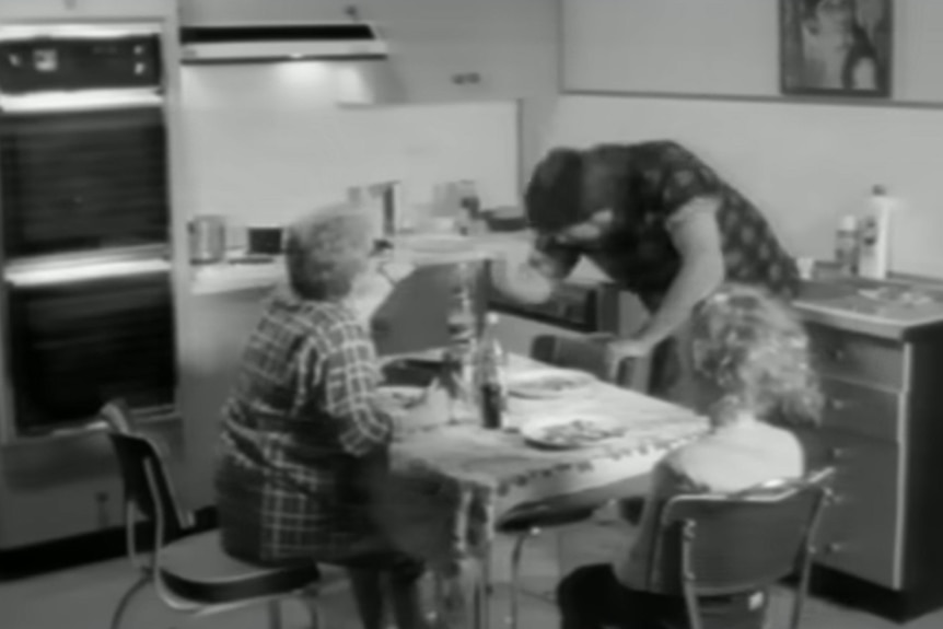 Derryn Hinch and Jackie Weaver in a black and white video