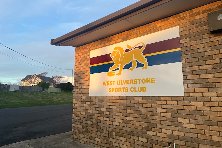 A football club with a sign that says 'West Ulverstone sports club' in the afternoon light.
