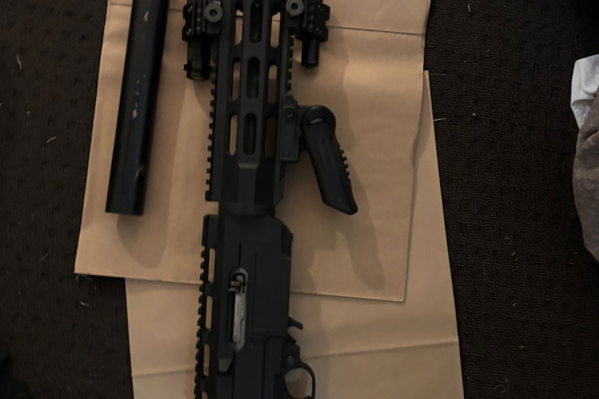 an image of a black pistol with modifications