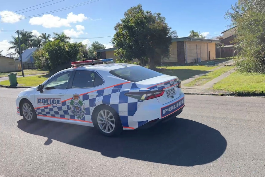 police car driving on street