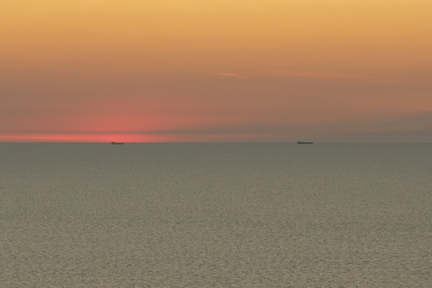 View from Darwin of sunset over the ocean.