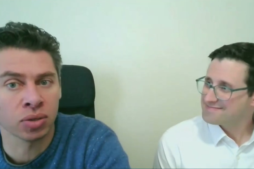 Two men on video camera