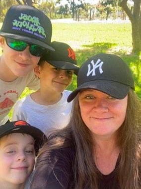 A woman and three boys.