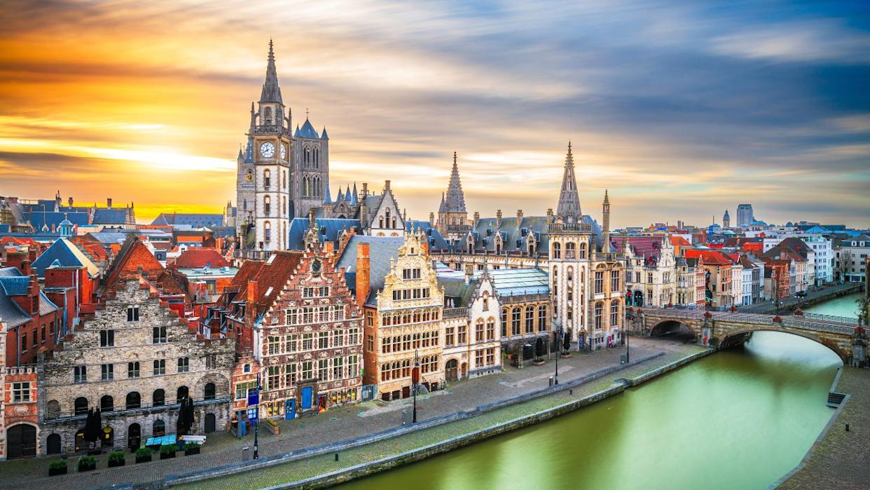 Ghent, Belgium old town cityscape from the Graslei area at dawn.