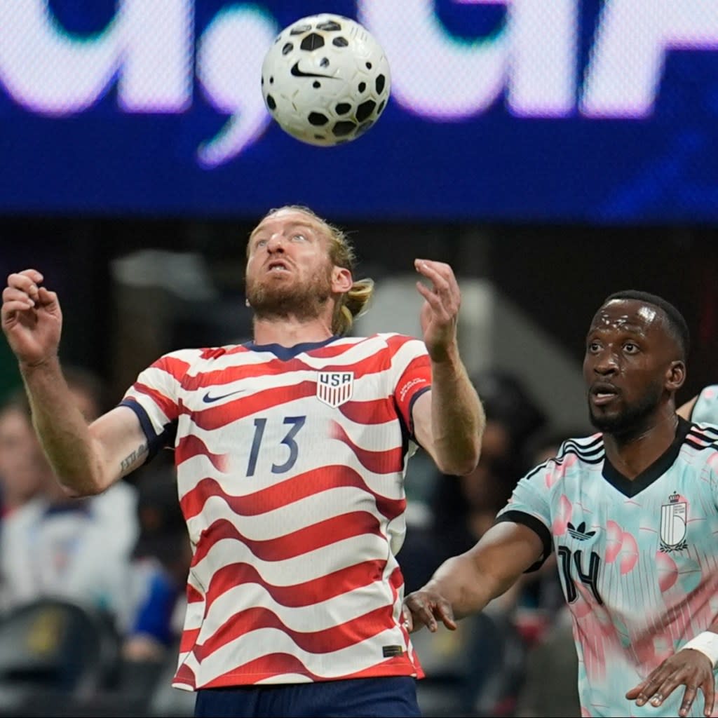 The US’s Tim Ream tries to control the ball as Belgium’s Dodi Lukebakio looks on, March 28, 2026. AP