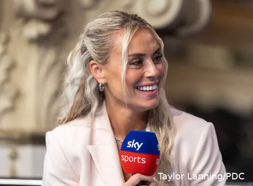 Emma Paton smiling while interviewing