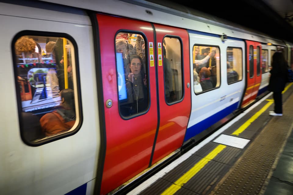 <p>Commuters squeeze into busy train carriages during April strikes</p>