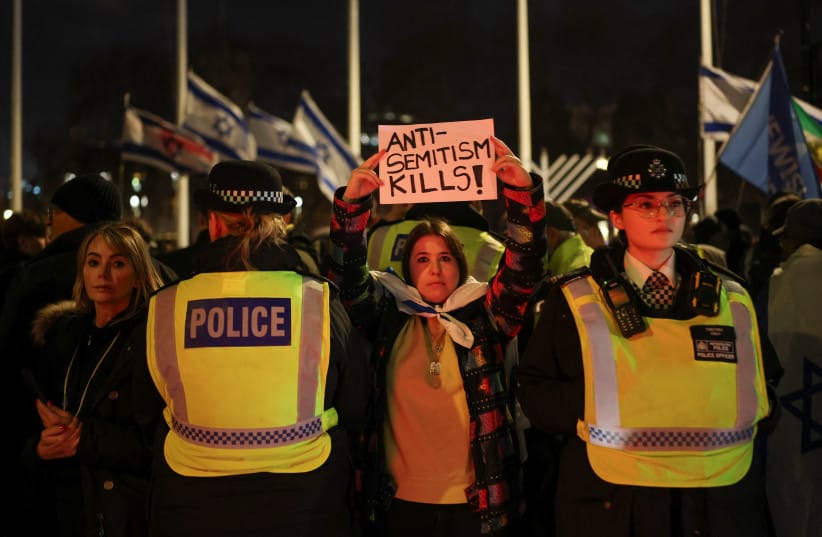 PEOPLE ATTEND a vigil organised by the Campaign Against Antisemitism and Chabad UK to honour victims of the Bondi attack in Sydney and mark the second night of Hanukkah, in London, Britain, December 15, 2025.