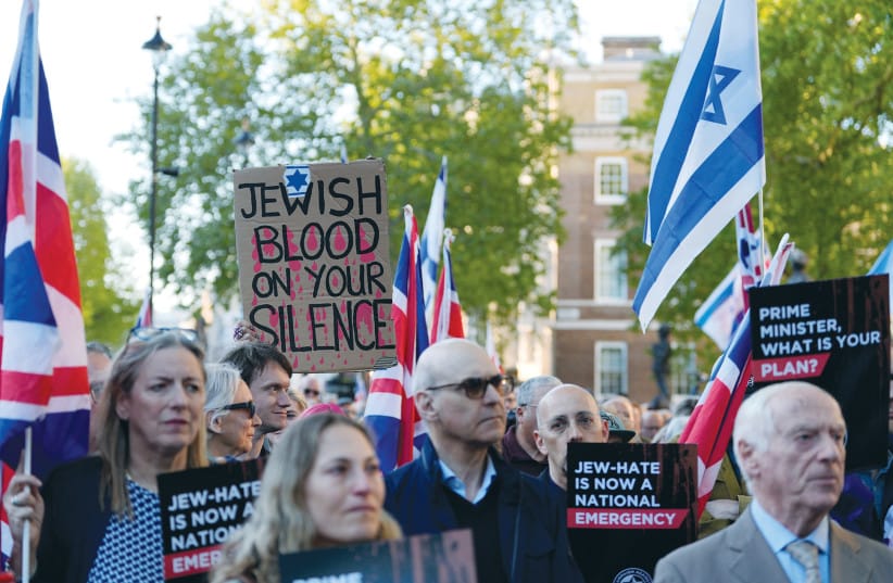 NO MORE SILENCE: A protester holds a sign reading ‘Jewish blood on your silence’ during a rally in London last month after the Golders Green antisemitic attack, capturing the anger and frustration felt within the Jewish community amid rising threats and attacks.