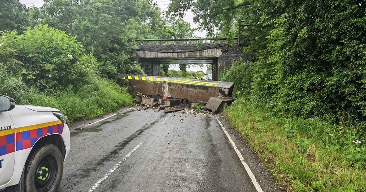 Lorry driver arrested after railway bridge collapse on main line into London | News UK