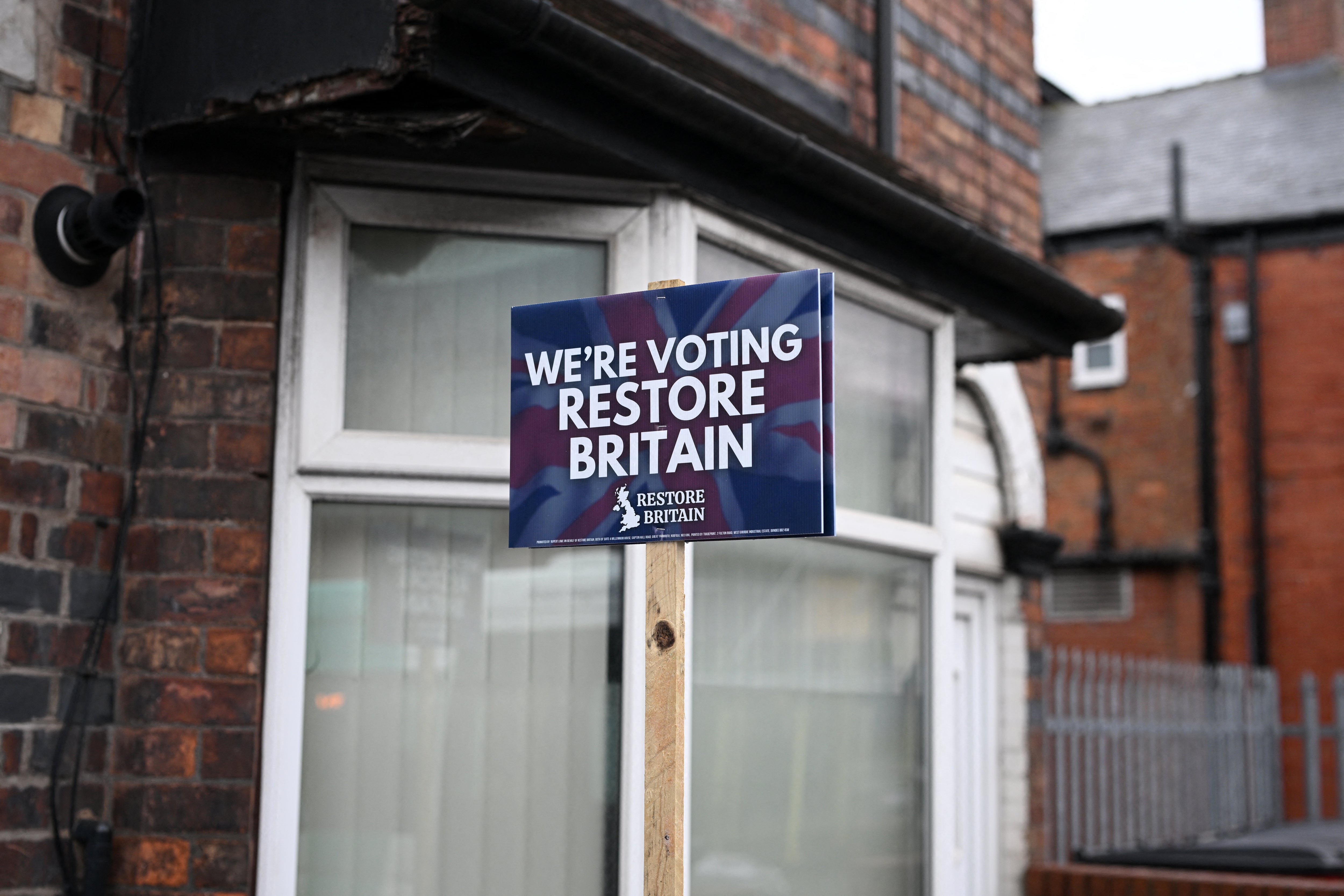 A Restore Britain banner at the Makerfield by-election