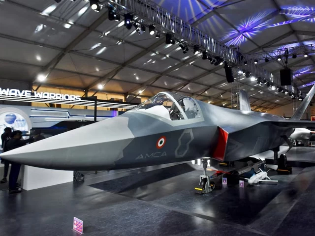visitors stand next to a prototype of the advanced medium combat aircraft amca india s most advanced stealth fighter jet at the aero india 2025 air show at yelahanka air base in bengaluru india february 11 2025 reuters