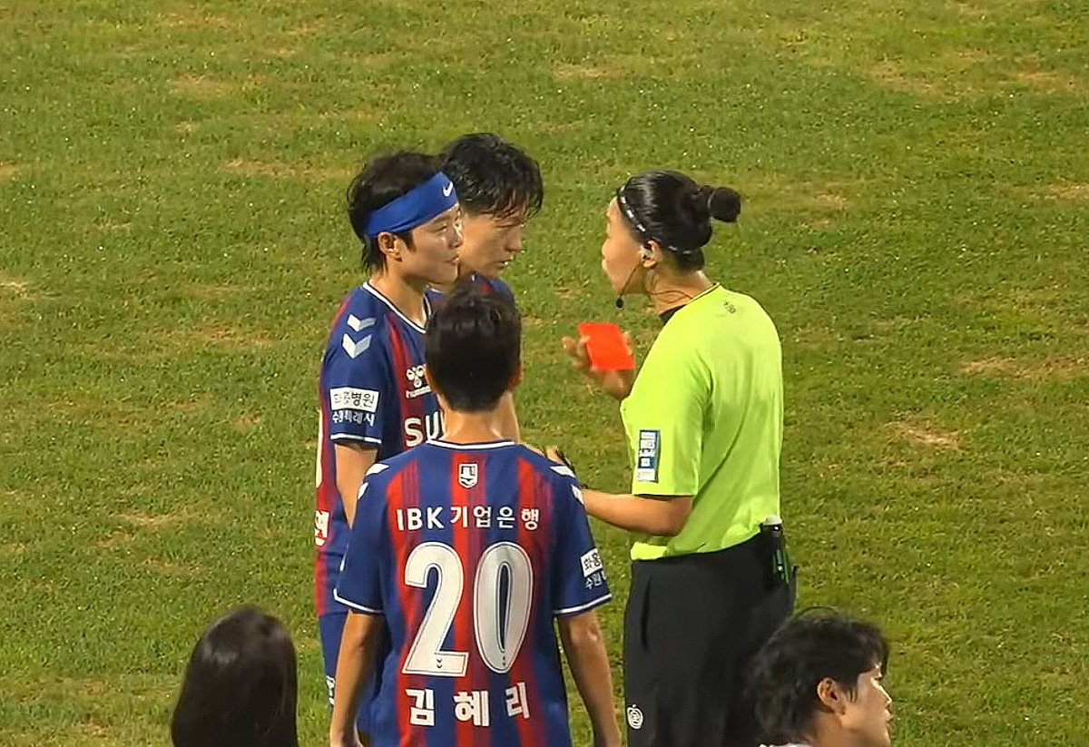 As absurd as sexual harassment remarks, controversy over a female soccer referee using a red card for 'threatening' purposes