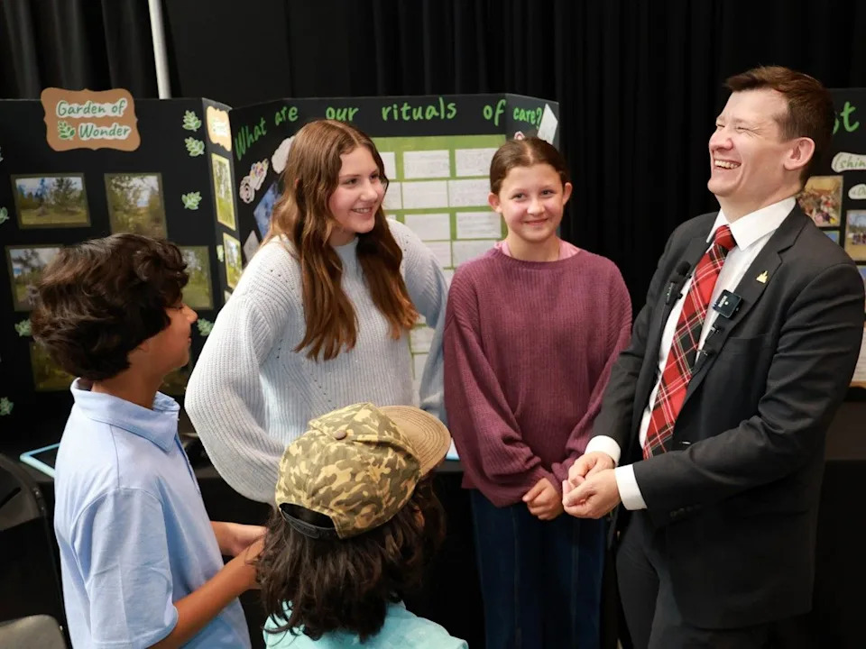 Mayor Jeromy Farkas shares a laugh with W.O. Mitchell School students at their booth during the 37th Annual Mayor’s Environment Expo at Calgary City Hall on Tuesday, June 2, 2026.