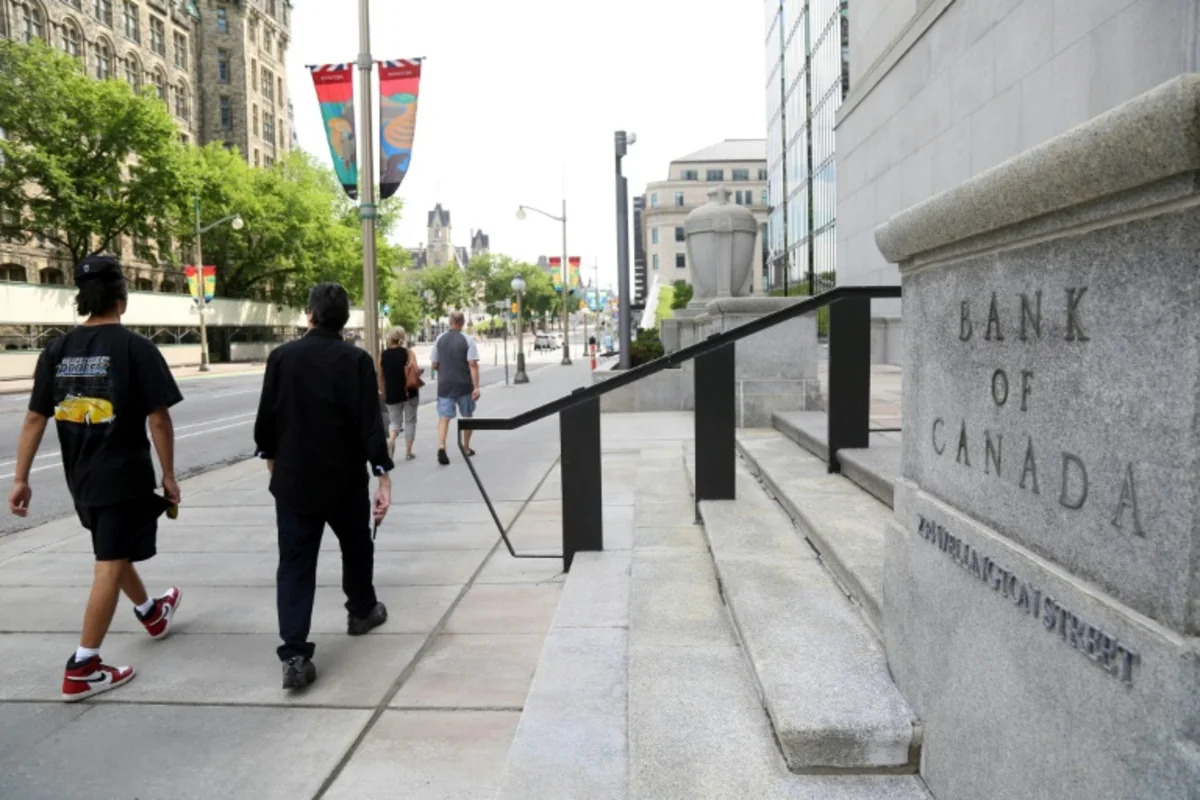 Canada central bank holds key rate steady, says economy improving