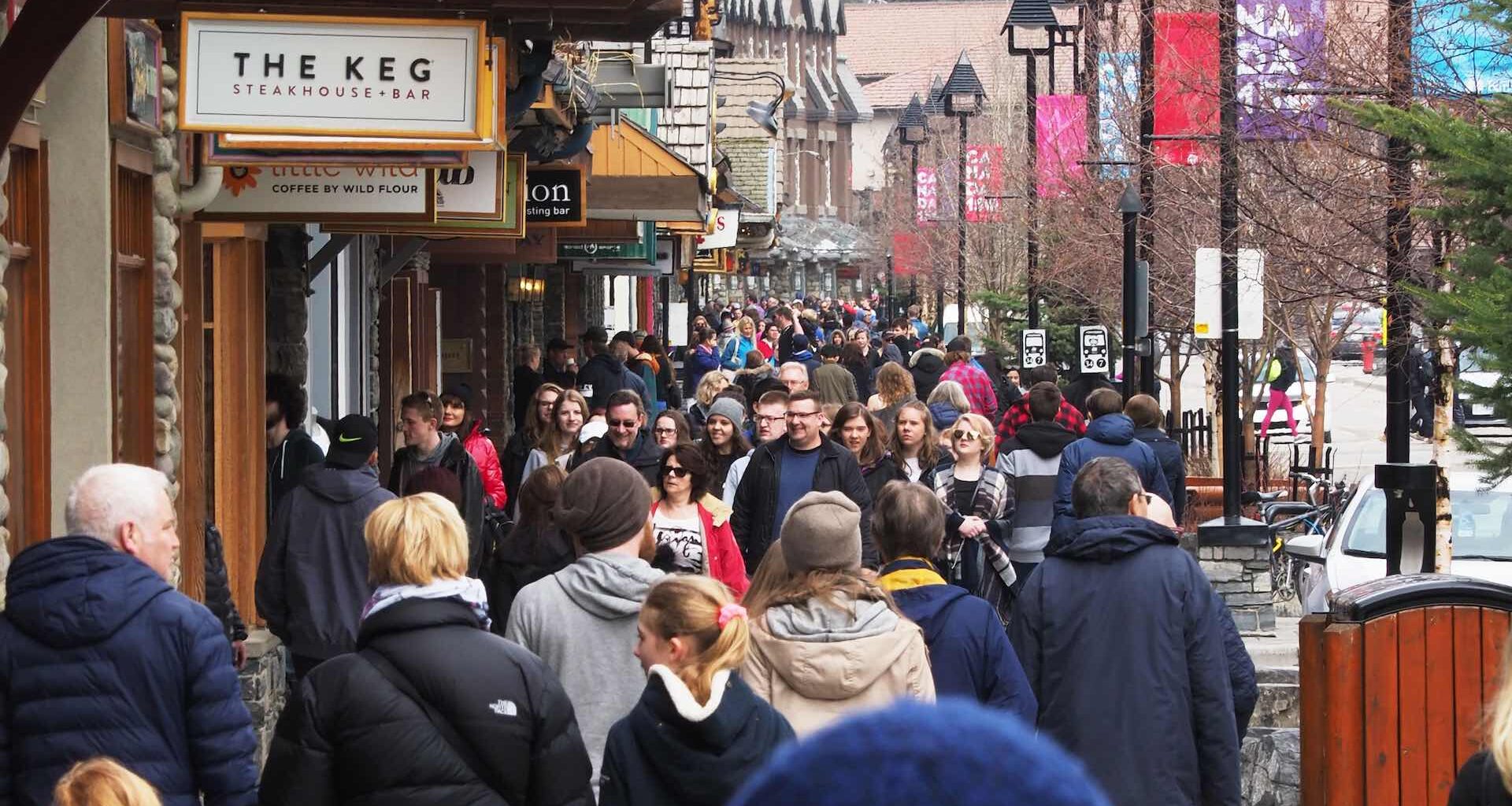 A shot of a crowded commercial walkway in the resort town of Banff, Alta.