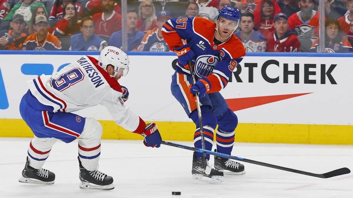 Edmonton Oilers forward Connor McDavid (97) makes a pass in front of Montreal Canadiens defensemen Mike Matheson (8) during the first period at Rogers Place.