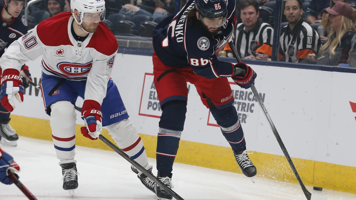 Montreal Canadiens right wing Joel Armia (40) and Columbus Blue Jackets right wing Kirill Marchenko (86) battle for a loose puck during the first period at Nationwide Arena.