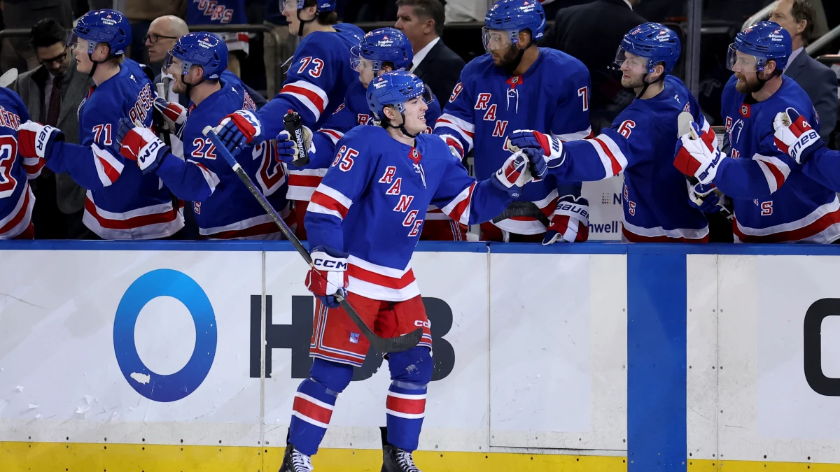 New York Rangers left wing Brett Berard (65) celebrates his goal against the Nashville Predators with teammates during the third period at Madison Square Garden.