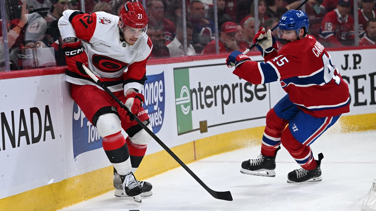 Carolina Hurricanes defenseman Alexander Nikishin (21) skates past Montreal Canadiens defenseman Alexandre Carrier (45) during the second period in game four of the Eastern Conference Final of the 2026 Stanley Cup Playoffs at Bell Centre.