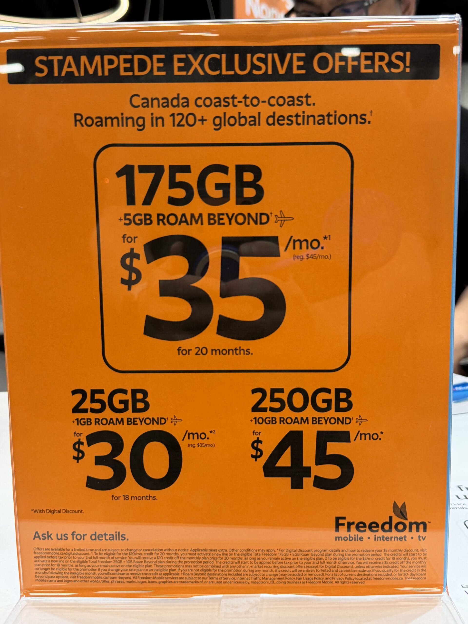 an orange poster showing some deals created by Freedom Mobile