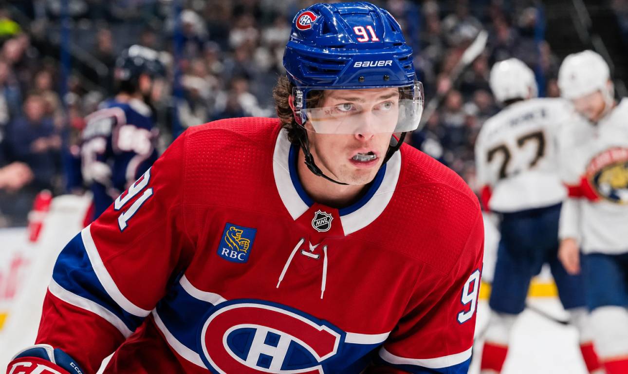 Kent Johnson wearing a Montreal Canadiens home jersey and helmet amid trade rumors linking him to the Canadiens