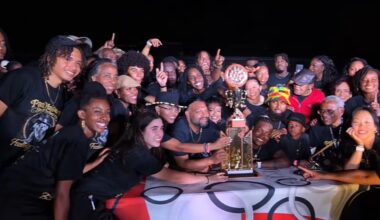 PanMasters Steel Orchestra celebrates with championship trophy for Toronto Panorama Pan Alive 2026 in the early hours of August 1 at the Lamport Stadium
