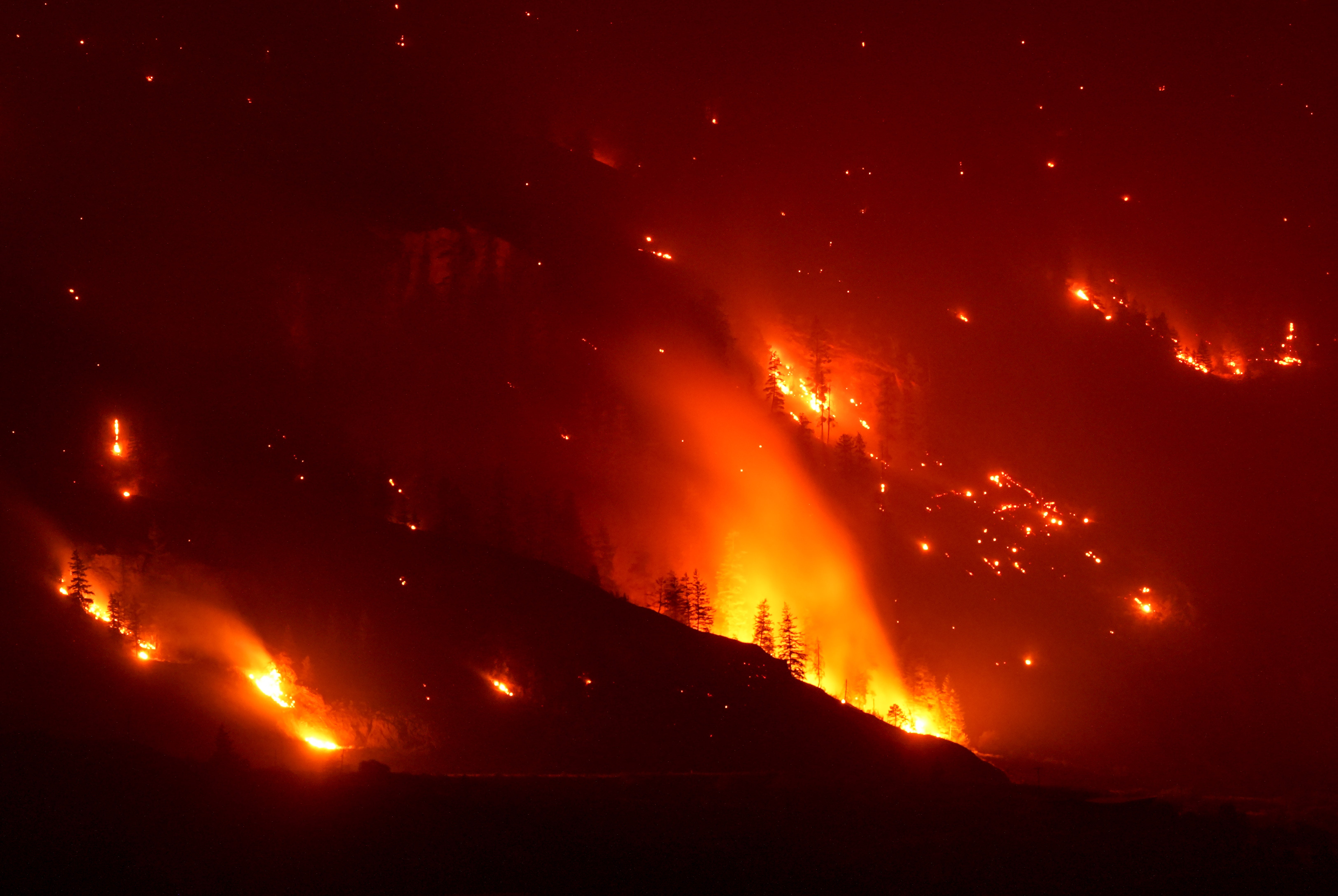 The Bald Range wildfire burns in Summerland, British Columbia late Saturday, Aug. 8, 2026. (Darryl Dyck/The Canadian Press via AP)