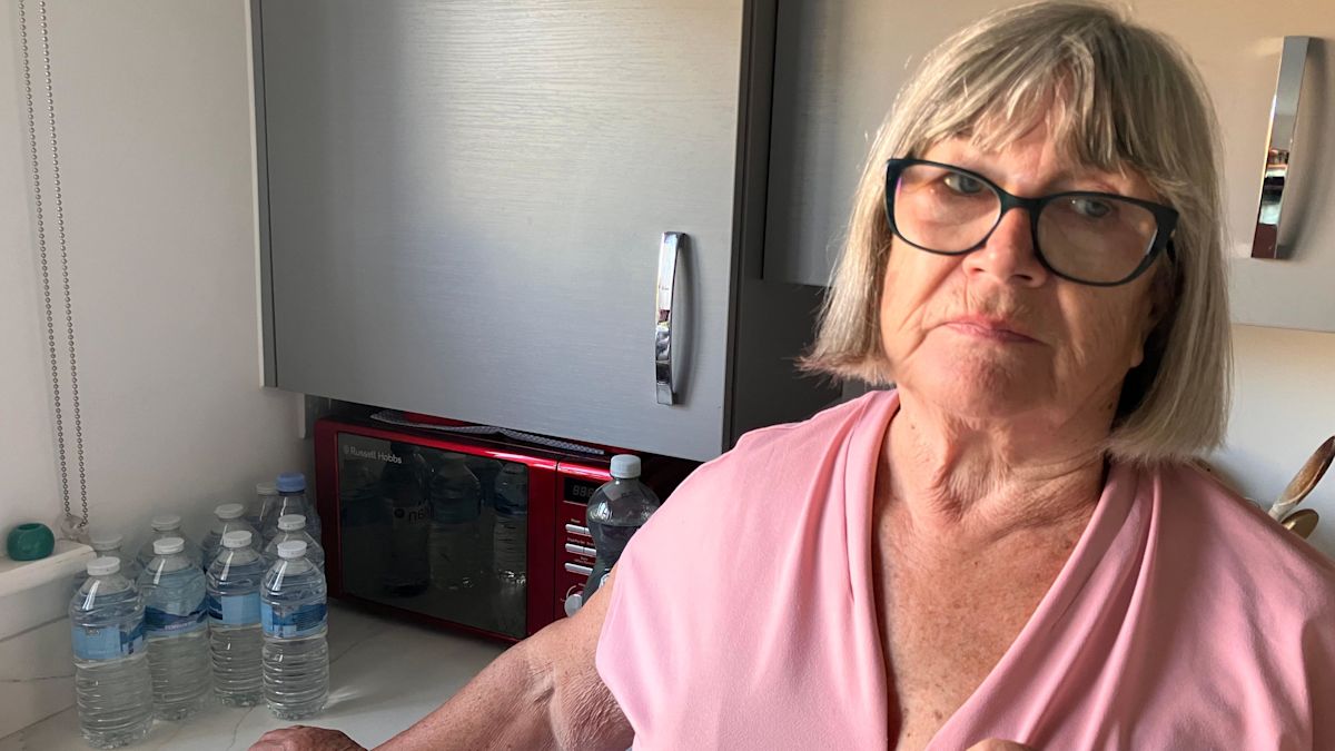 Woman buys back-up bottles due to water 'trickle'
