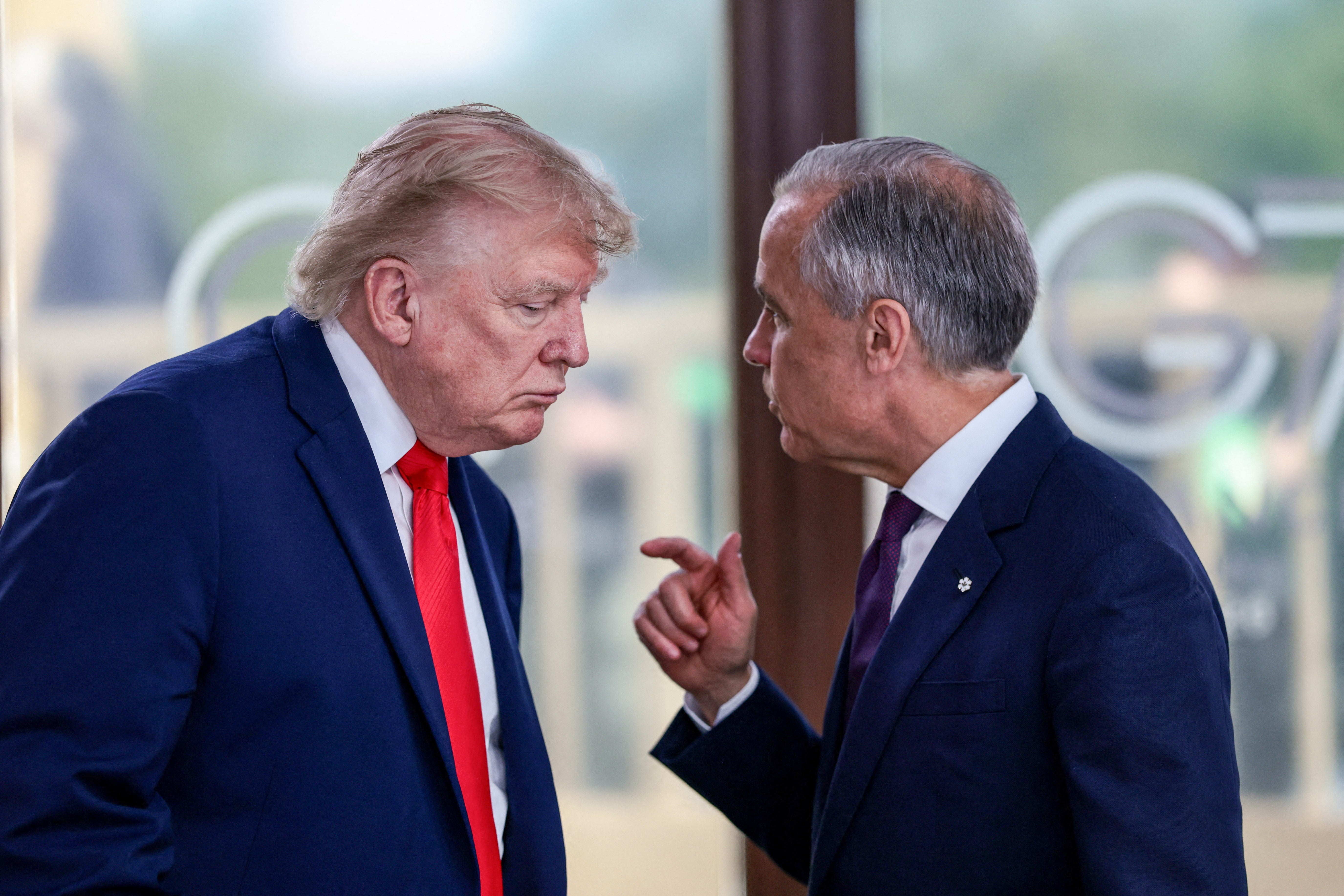 US President Donald Trump speaking with Canada's Prime Minister Mark Carney (AFP/Getty)