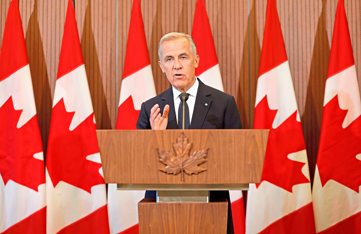 US tariffs imposed on Canada go into effect