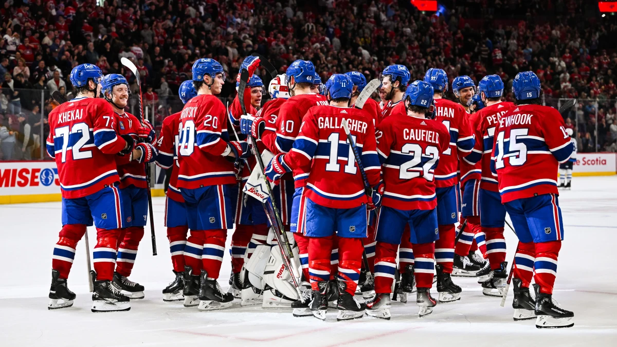 Montreal Canadiens players celebrate their victory over the Winnipeg Jets after the game at the Bell Centre.