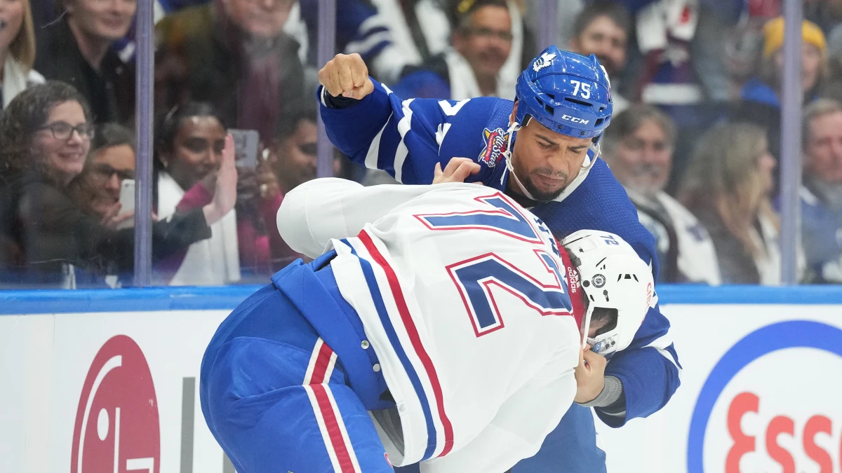 Toronto Maple Leafs right wing Ryan Reaves (75) fights with Montreal Canadiens defenseman Arber Xhekaj (72) during the first period at Scotiabank Arena.