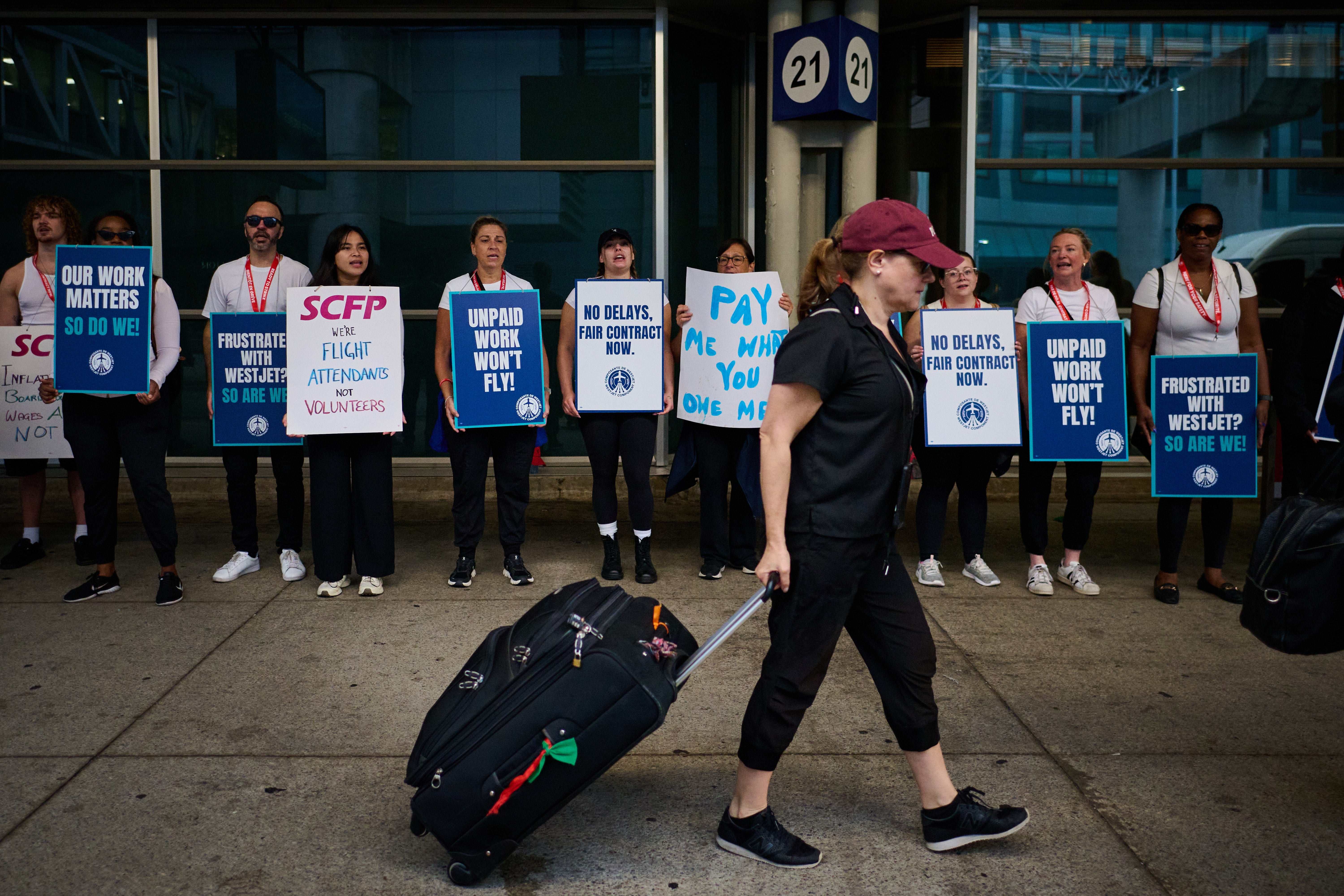 Flight attendants with WestJet, Canada’s second-largest airline, went on strike Sunday over a pay dispute between their union and the carrier