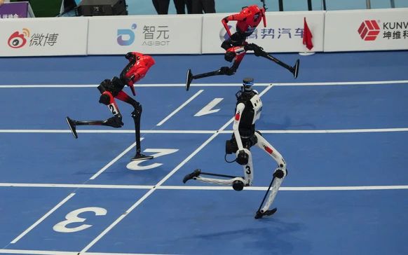 Humanoid robot competes in the 100m race during the World Humanoid Robot Games in Beijing, Tuesday, Aug. 25, 2026. (AP Photo/Achmad Ibrahim)
China Humanoid Robot Games