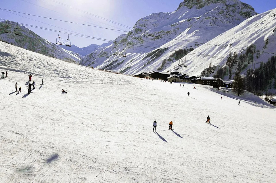 Skiers at Courchevel. Rosewood Courchevel Le Jardin Alpin