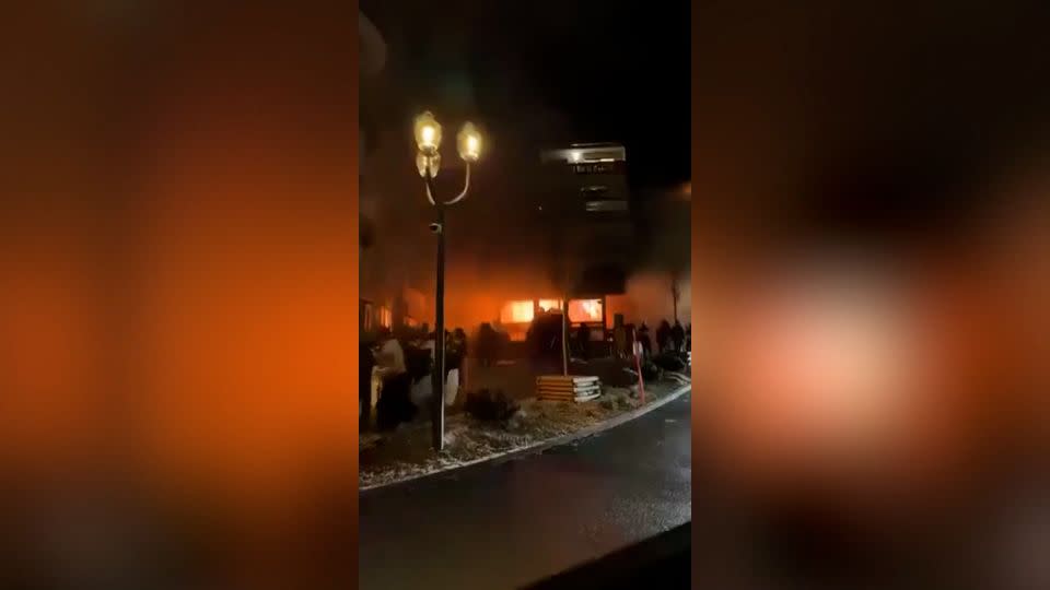 Social media video shows the fire engulfing the venue in the early hours of New Year's Day. - From social media