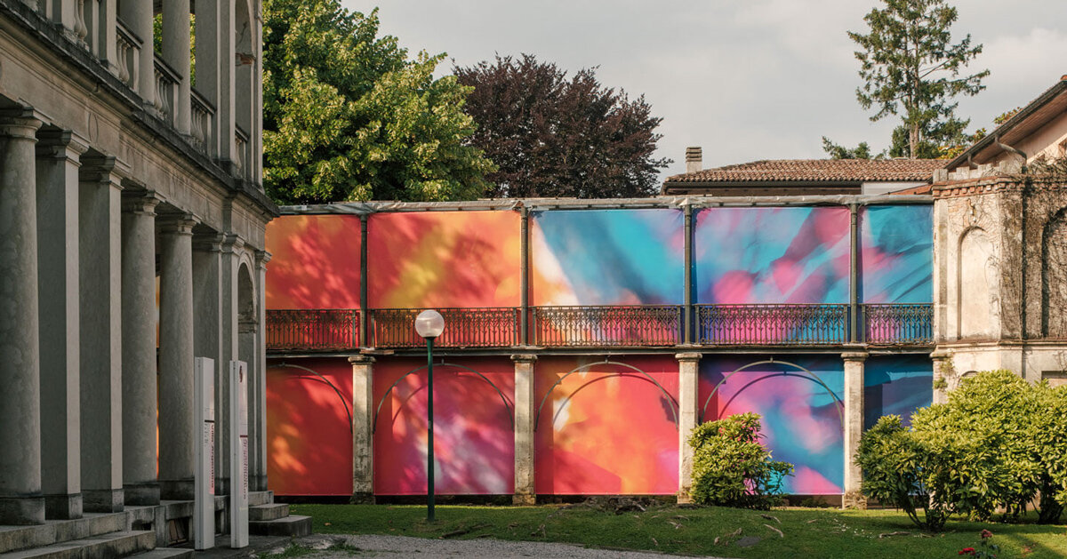 colorful textile installation reimagines historic laundry building in switzerland