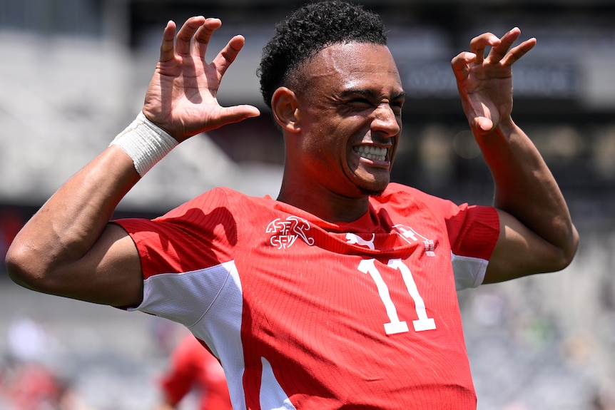 Dan Ndoye celebrates a goal for Switzerland against the Socceroos.