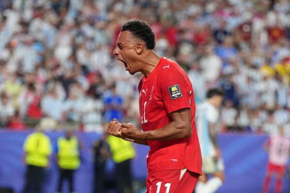 Switzerland's Dan Ndoye (11) celebrates scoring his side's first goal during the World Cup quarterfinal soccer match between Argentina and Switzerland in Kansas City, Mo., Saturday, July 11, 2026. (AP Photo/Abbie Parr)