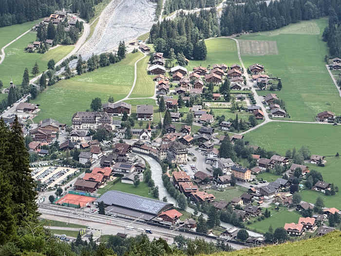 A looming rock collapse threatens a Swiss village as thawing permafrost destabilizes the Alps