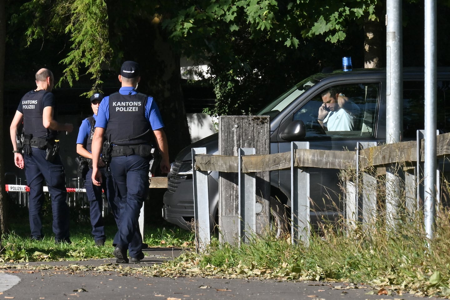 Police officers secure the area where a shooting occurred, in Aarau, northern Switzerland, on Aug. 30, 2026. One person was killed and five others were wounded, some of them seriously, in a shooting at a rave party in northern Switzerland, local police said.