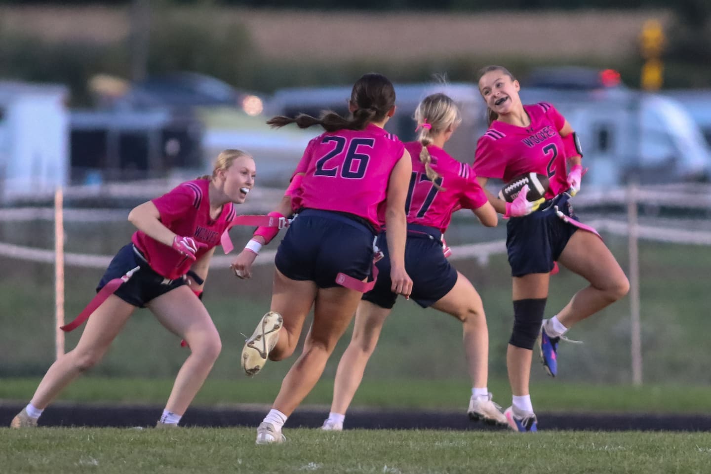 Oswego East's Adia Portell (2) celebrates a touchdown scramble during Oswego East Regional final flag football game between Geneva and Oswego East. Oct 7, 2026 in Oswego.